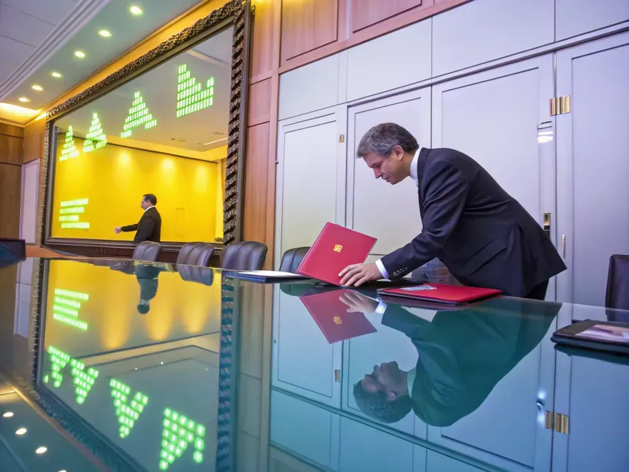 A corporate boardroom reflecting a treasury stock folder and glowing accounting symbols.